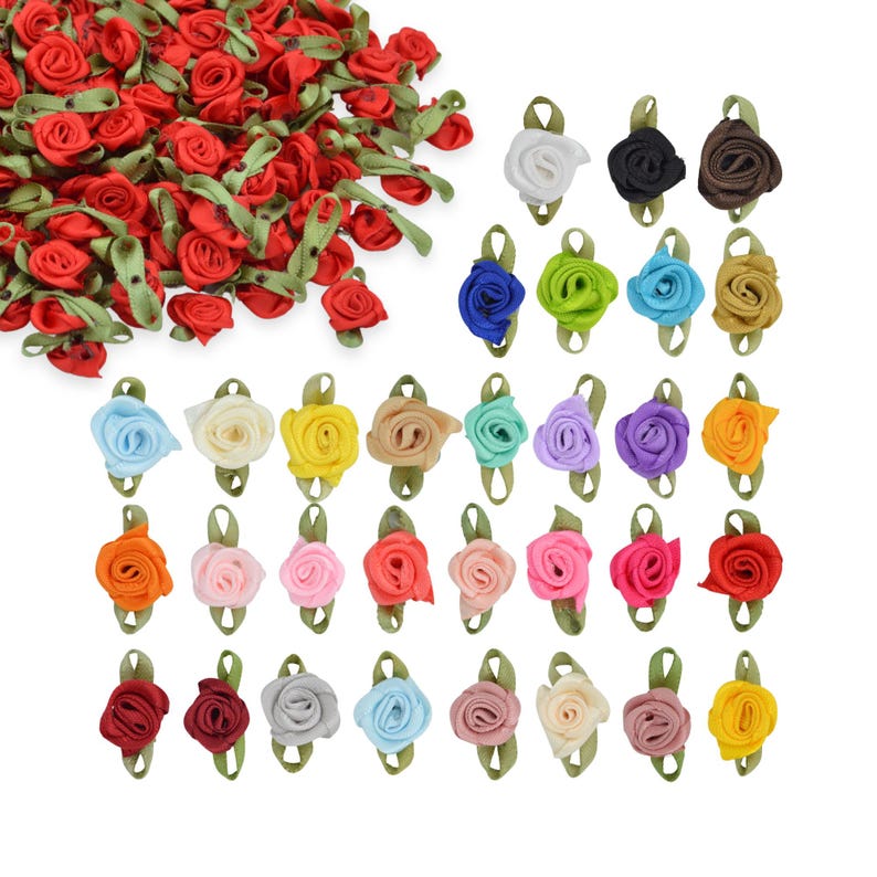 May include: Assortment of 30 small, fabric, rose-shaped embellishments in various colors, including red, blue, green, yellow, orange, pink, purple, and white. Each rose has a green leaf attached.