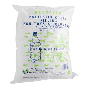 May include: A white plastic bag containing recycled polyester craft filling for toys and cushions. The bag features blue and green text, including the phrase 'i used to be a plastic bottle', along with illustrations of plastic bottles and small green footprints.