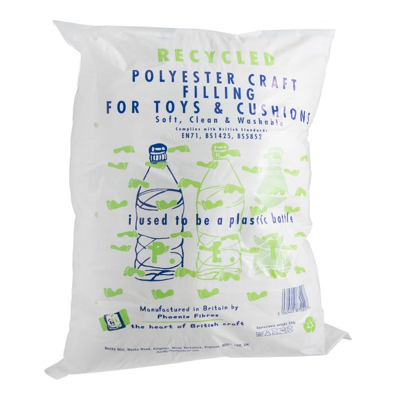 May include: A white plastic bag containing recycled polyester craft filling for toys and cushions. The bag features blue and green text, including the phrase 'i used to be a plastic bottle', along with illustrations of plastic bottles and small green footprints.