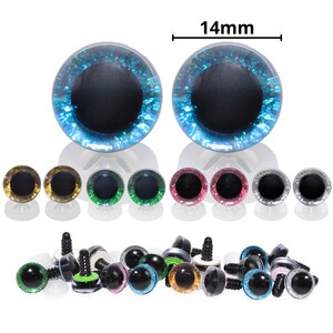 May include: A collection of colorful craft eyes, including two large blue glitter eyes, measuring 14mm. Additional sets of gold, green, pink, and silver eyes are displayed, along with a variety of black plastic eye fasteners.