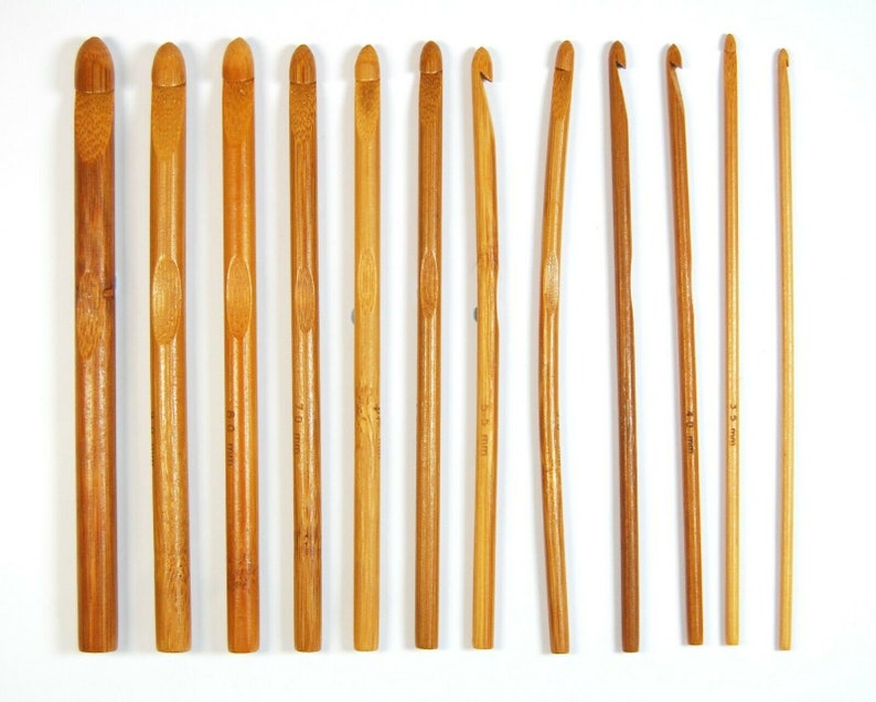 May include: Set of 10 bamboo crochet hooks in various sizes, ranging from 3.5 mm to 8.0 mm. The hooks are made of natural bamboo and have a smooth, polished finish.