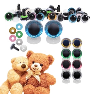May include: A collection of craft supplies including various sizes and colors of plastic safety eyes with washers, glittery eye backing, and two plush teddy bears. The eyes are in shades of green, blue, gold, and pink.