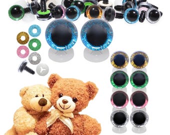 May include: A collection of craft supplies including various sizes and colors of plastic safety eyes with washers, glittery eye backing, and two plush teddy bears. The eyes are in shades of green, blue, gold, and pink.