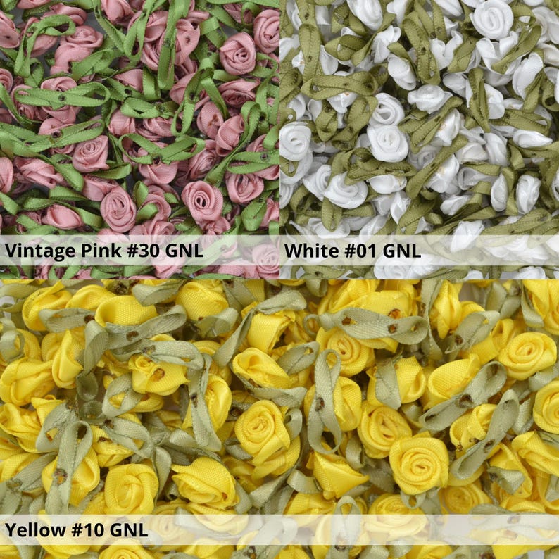 May include: Assortment of small, fabric rose embellishments in vintage pink, white, and yellow. Each rose has a green ribbon attached. The text "Vintage Pink #30 GNL", "White #01 GNL", and "Yellow #10 GNL" is displayed below each color.