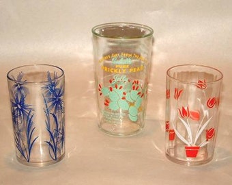 White and Green Daisy pattern Swanky Swigs Juice Cups with a Red 3 12 tall.