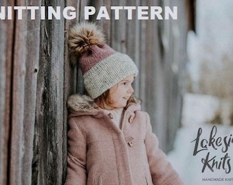 May include: A child wearing a pink coat and a knitted hat with a fur pom-pom. The hat is white and pink. The text "KNITTING PATTERN" is at the top of the image. The Lakeside Knits co. logo is in the bottom right corner.