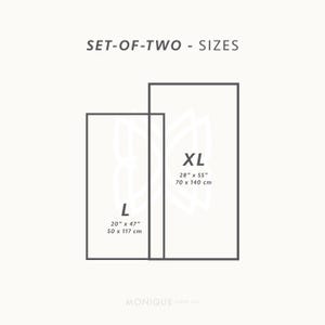 May include: A graphic showing two rectangular sizes, labeled L and XL, with dimensions in inches and centimeters. The L size is 20" x 47" (50 x 117 cm), and the XL size is 28" x 55" (70 x 140 cm). The text "SET-OF-TWO - SIZES" is at the top.