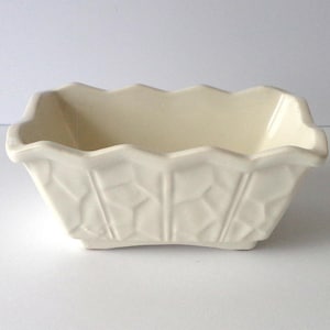 May include: A set of three ceramic mugs with a speckled, matte finish. Each mug features a different color: light blue, cream, and gray. The mugs have a simple, modern design and a comfortable handle.