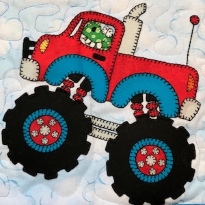 May include: A red monster truck with blue trim and large black tires. The truck has a white exhaust pipe and a red antenna. The truck is driving on a white background with blue clouds.