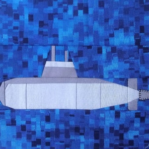 May include: A gray submarine with a white top and a black periscope is submerged in a blue and black pixelated pattern.