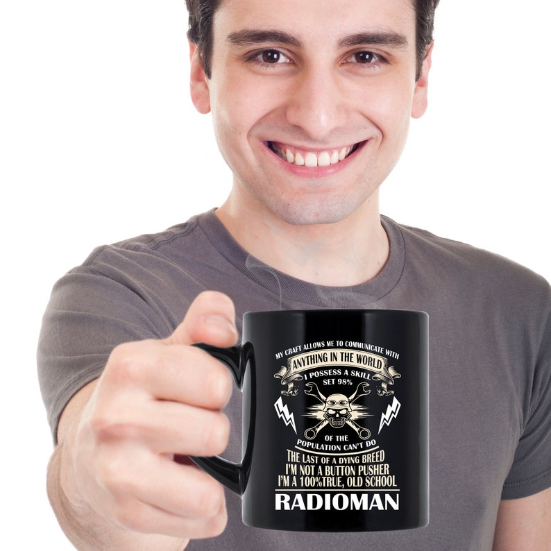 May include: Black coffee mug with a white design. The text reads "My craft allows me to communicate with anything in the world. I possess a skill set 98% of the population can't do. The last of a dying breed. I'm not a button pusher. I'm a 100% true, old school Radioman."