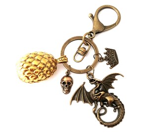 Porte clef dragon oeuf couronne roi tete de mort steampunk rock rockabilly gothique laiton bronze doré game of Thrones fantasy trousseau