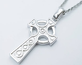 May include: Silver Celtic cross pendant necklace with a detailed knot design and a textured finish.