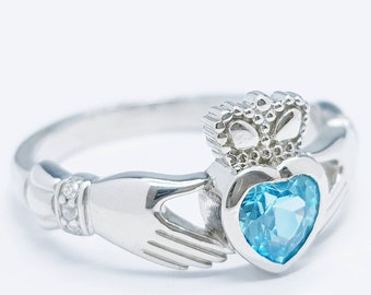 Sterling Silver Claddagh ring set with electric blue heart shaped stone, Irish claddagh rings