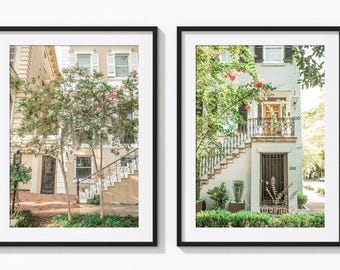 May include: Two black framed prints of a white building with a black door and a black railing. The building is surrounded by green trees and bushes. The building has the number 202 on the door.
