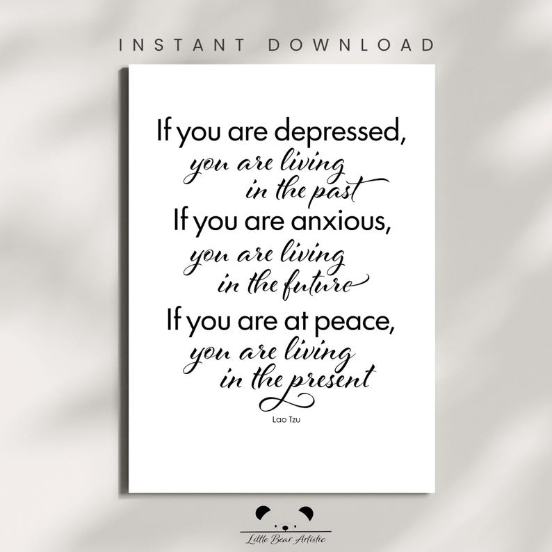 May include: A white print with black calligraphy text. The text reads: "If you are depressed, you are living in the past. If you are anxious, you are living in the future. If you are at peace, you are living in the present." The quote is attributed to Lao Tzu.