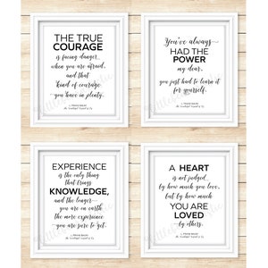 May include: Four black and white printable quotes in white frames on a wood background. The quotes are: "The true courage is facing danger when you are afraid, and that kind of courage you have in plenty." - L. Frank Baum, "You've always had the power my dear, you just had to learn it for yourself." - L. Frank Baum, "Experience is the only thing that brings knowledge, and the longer you are on earth the more experience you are sure to get." - L. Frank Baum, "A heart is not judged by how much you love, but by how much you are loved by others." - L. Frank Baum
