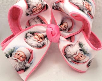 Lazo rosa con cara de Papá Noel: pinza para el pelo navideña