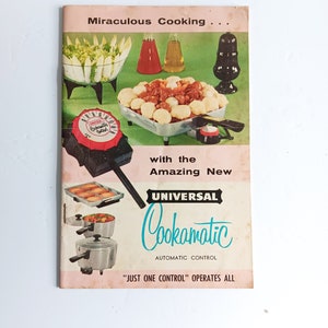 May include: A retro cookbook cover advertising the "Universal Cookamatic Automatic Control." The cover is pink and features illustrations of food and cooking equipment. The text reads "Miraculous Cooking".