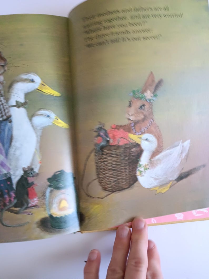 May include: An illustrated page from a children's book featuring anthropomorphic animals. A rabbit, ducks, and a mouse are depicted in a whimsical scene. The rabbit wears a floral crown and necklace, holding a basket. The ducks have yellow beaks.