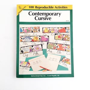May include: A softcover educational workbook titled 100 Reproducible Activities Contemporary Cursive by Instructional Fair. The cover features a green border, yellow header, and a collage of alphabet practice sheets with colorful animal illustrations.