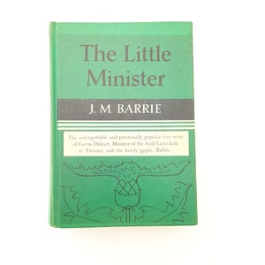 May include: A hardcover book titled "The Little Minister" by J.M. Barrie. The book has a green cover with white text and a thistle illustration. The text on the cover includes the title and author's name. A description of the book is also included.