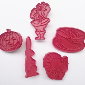 Five Red Tupperware Holidays Through the Year Cookie Cutter Set  Holiday 2021 A Santa, Jack O Lantern, Cake, Rabbit, Tom Turkey