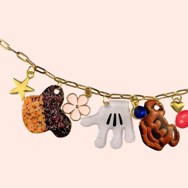 May include: A set of three ceramic mugs with a speckled, matte finish in cream, light brown, and dark brown. Each mug has a simple, minimalist design, ideal for tea or coffee.