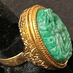 Vintage Avon Aqua engraved faux stone and gold tone statement ring with hinged opening for solid perfume