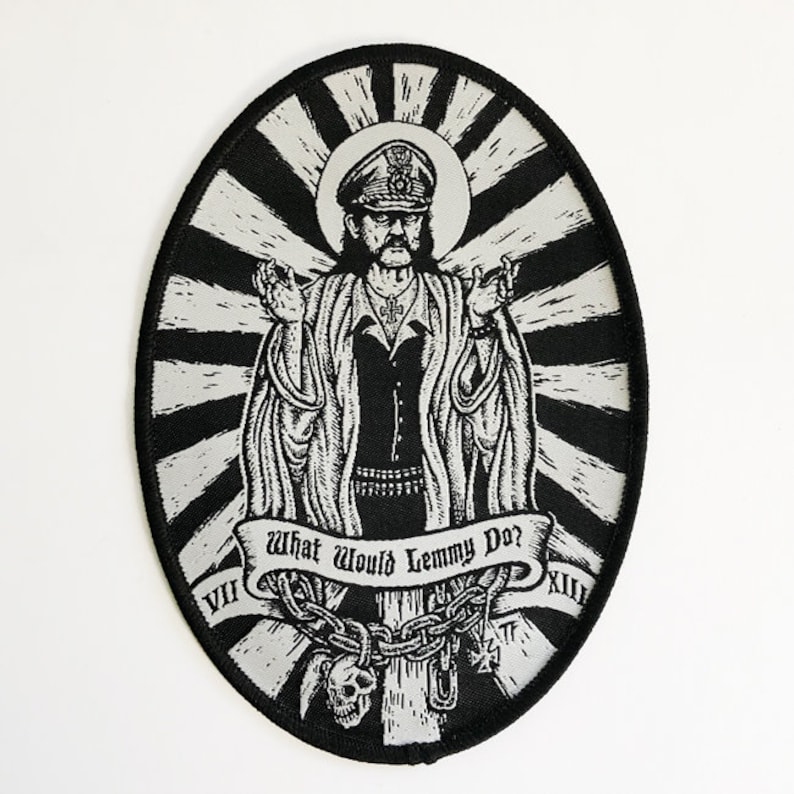 May include: Black and white embroidered patch of a man with a mustache and a hat, with the words "What Would Lemmy Do?" and Roman numerals VII and XII.