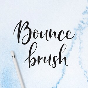 May include: A white background with blue watercolor accents features the text "Bounce brush" written in black cursive script. A white stylus is lying on the surface.