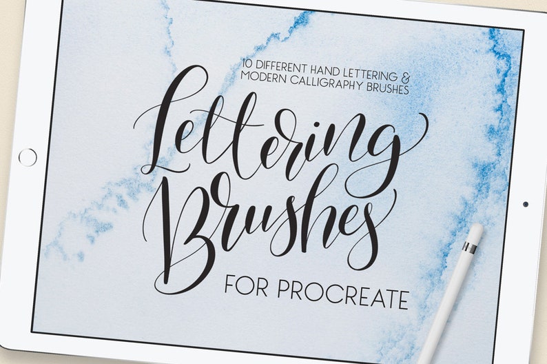 May include: A digital illustration of a white tablet with a blue watercolor background. The text "Lettering Brushes for Procreate" is written in black cursive font. The text "10 Different Hand Lettering & Modern Calligraphy Brushes" is written in smaller black font above the main text.