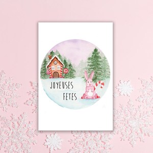 Carte de voeux "Joyeuses fêtes" - Illustration lapin et maison de pain d'épices dans un paysage de neige