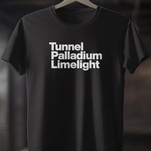 May include: Black t-shirt with white text that reads "Tunnel Palladium Limelight"
