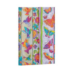May include: A colorful journal with a floral and butterfly design. The cover features hummingbirds and butterflies in shades of pink, purple, blue, green, yellow, and orange.