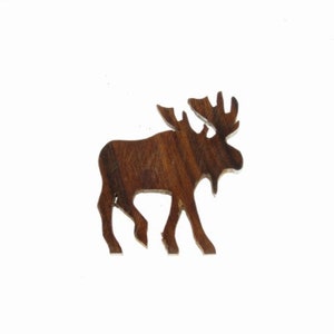 May include: A wooden moose cutout, with a dark brown wood grain, is a simple and elegant decoration for a home or office.