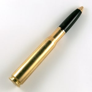 May include: A gold-colored bullet casing with a black plastic tip. The casing is smooth and shiny.