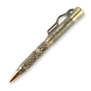 May include: A gold-toned pen with a decorative, engraved design. The pen has a textured, brown barrel and a copper-coloured tip.