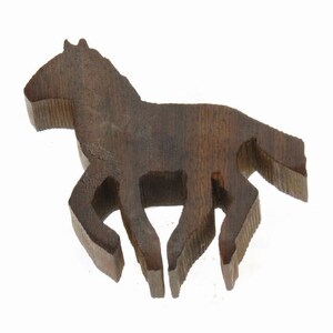 May include: A dark brown wooden horse figurine, carved in a running pose. The horse has a long mane and tail, and its legs are bent as if it is galloping.