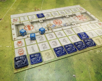 May include: A close-up of a board game with blue dice and blue tokens that say "RE-ROLL". The board has a grid of numbers and a white hourglass icon.