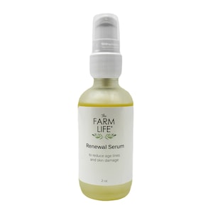 May include: A clear glass bottle with a white pump top and label that reads "The Farm Life" and "Renewal Serum to reduce age lines and skin damage". The bottle contains a yellow liquid and is labeled 2 oz.