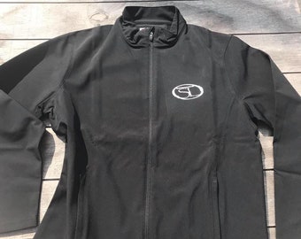 May include: A black zippered jacket with a white embroidered logo on the left chest. The logo is a circle with the letters "SD" inside.