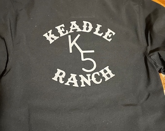 May include: Black long-sleeved shirt with a white embroidered logo that says "Keadle K5 Ranch".