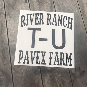 May include: White sign with black text that reads "River Ranch T-U Pavex Farm".