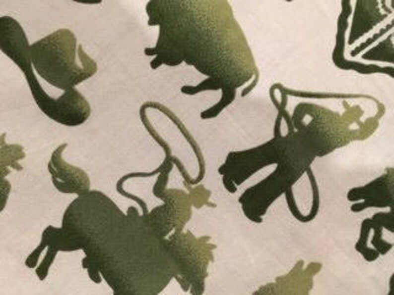 May include: Green silhouette pattern on a white background featuring a cowboy hat, a lasso, a cowboy riding a horse, a steer, and a cowboy boot.