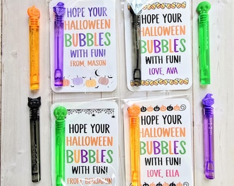 May include: Four Halloween bubble wands in clear packaging. Each wand has a different coloured handle: orange pumpkin, purple witch hat, black cat, and green skull. The cards read "Hope Your Halloween Bubbles With Fun!" with names.