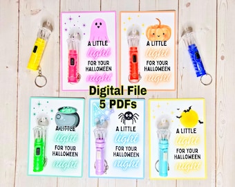 May include: A set of digital Halloween-themed files. Each file includes a colourful flashlight keyring and a card with the text "A LITTLE light FOR YOUR HALLOWEEN night". The cards feature Halloween graphics such as a ghost, pumpkin, and spider.