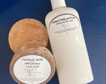 May include: A set of two brown loofah scrub bars and a white bottle of lotion. The loofah bars are labeled "Oatmeal, Milk and Honey Loofa Scrub" and the lotion bottle is labeled "Oatmeal, Milk and Honey Handcrafted Aloe Lotion". Both products are from the brand "Whispering Scents".