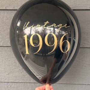 Black and gold 30th Birthday latex balloon that reads Vintage 1996 in a gold metallic font.  Perfect for a 30th Milestone, such as a Birthday, Anniversary or Class Reunion.