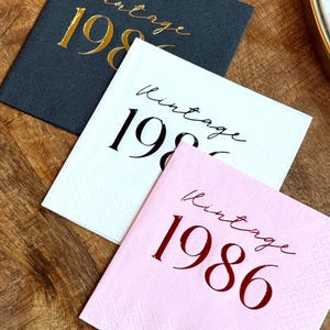 40th Birthday Cocktail Napkins.  The napkins read vintage 1986.  They are stamped in foil, red foil, black foil, and gold foil.  Then napkins are black, pink and white.  The napkins make perfect birthday decorations for a 40th Milestone Celebration